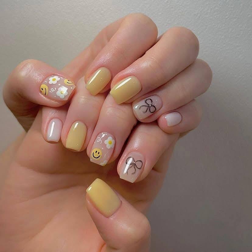 Yellow Smiley Nails