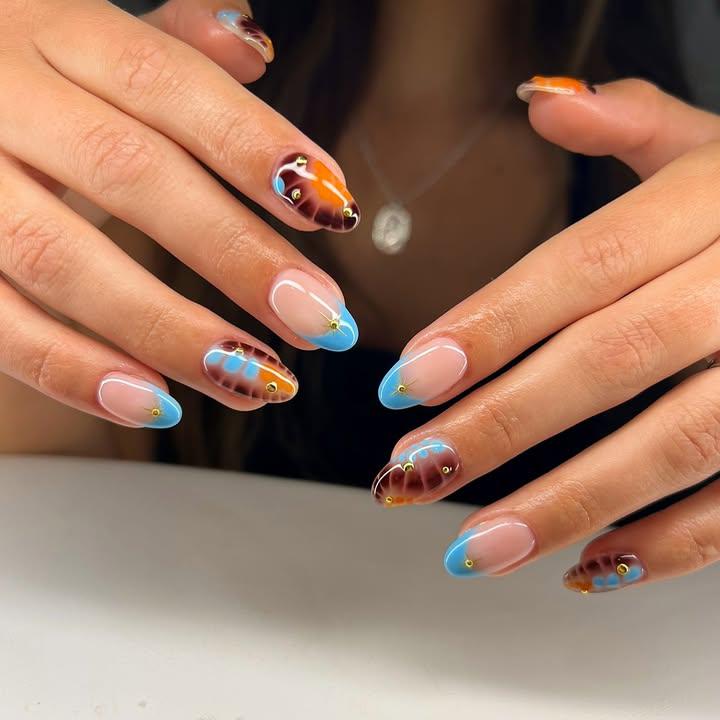 Colorful Abstract Nail Art with Blue and Brown Accents