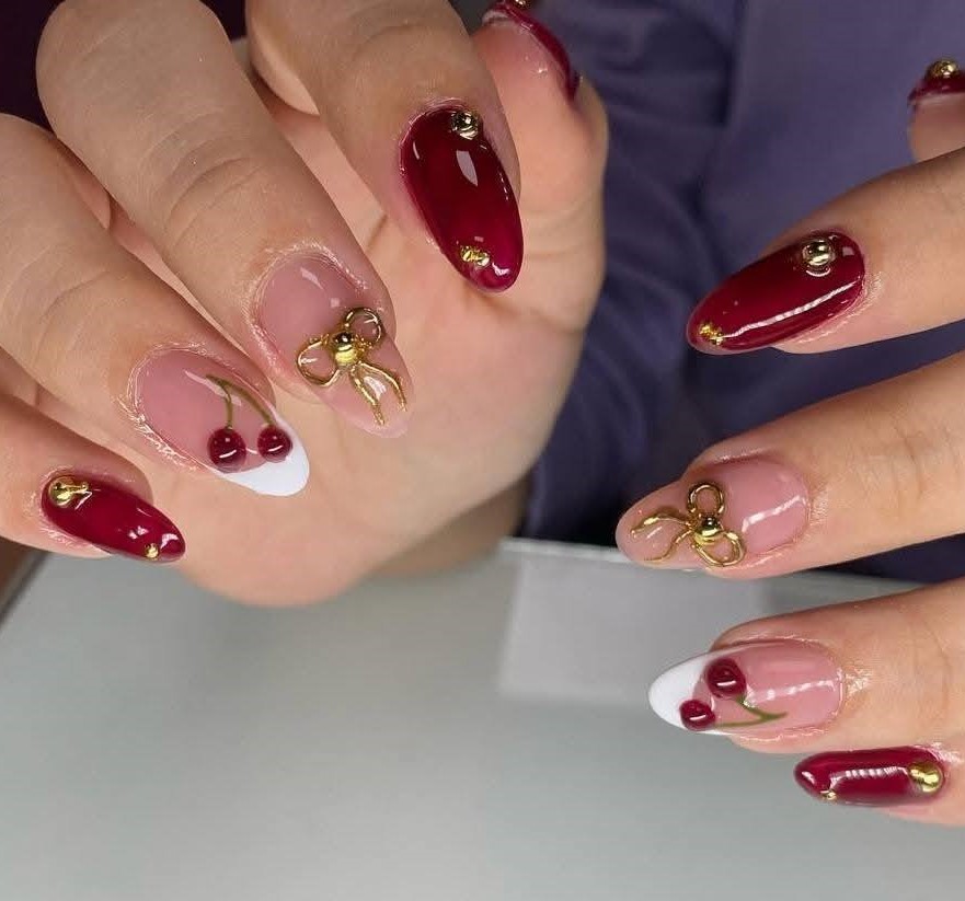 Burgundy Cherry Nails with Gold Bows