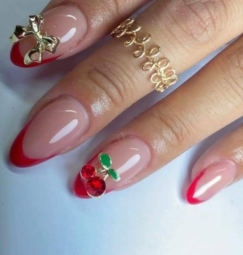 Red-Tipped Cherry Nails with Gold Accents