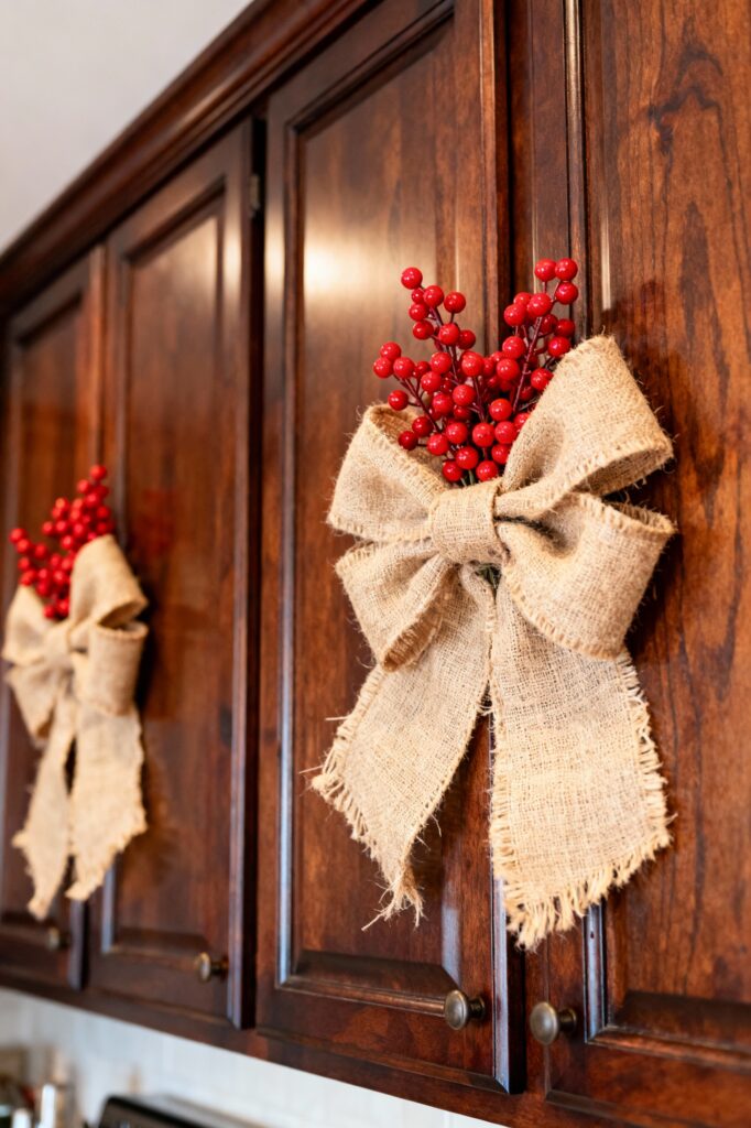 Rustic Burlap Bows with Berries on Dark Cabinets