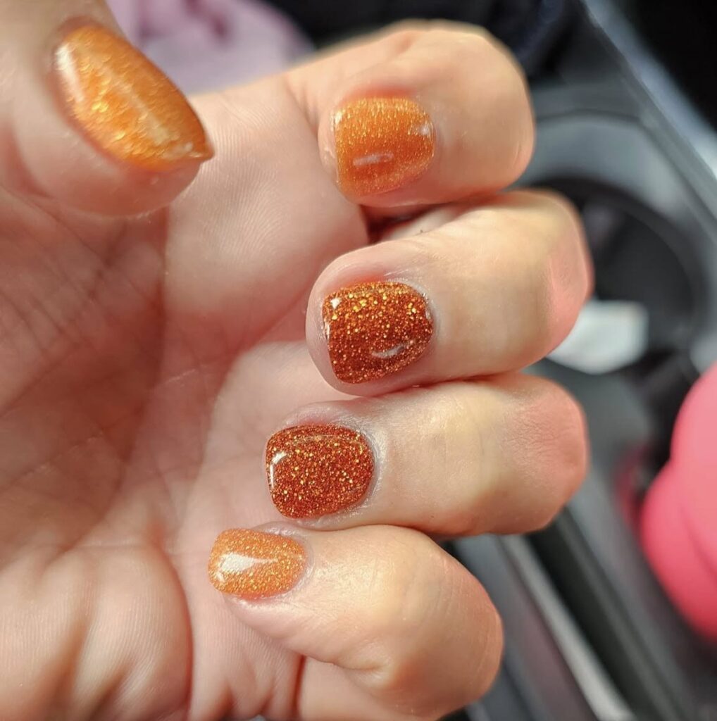Simple Thanksgiving Nails with Orange Glitter
