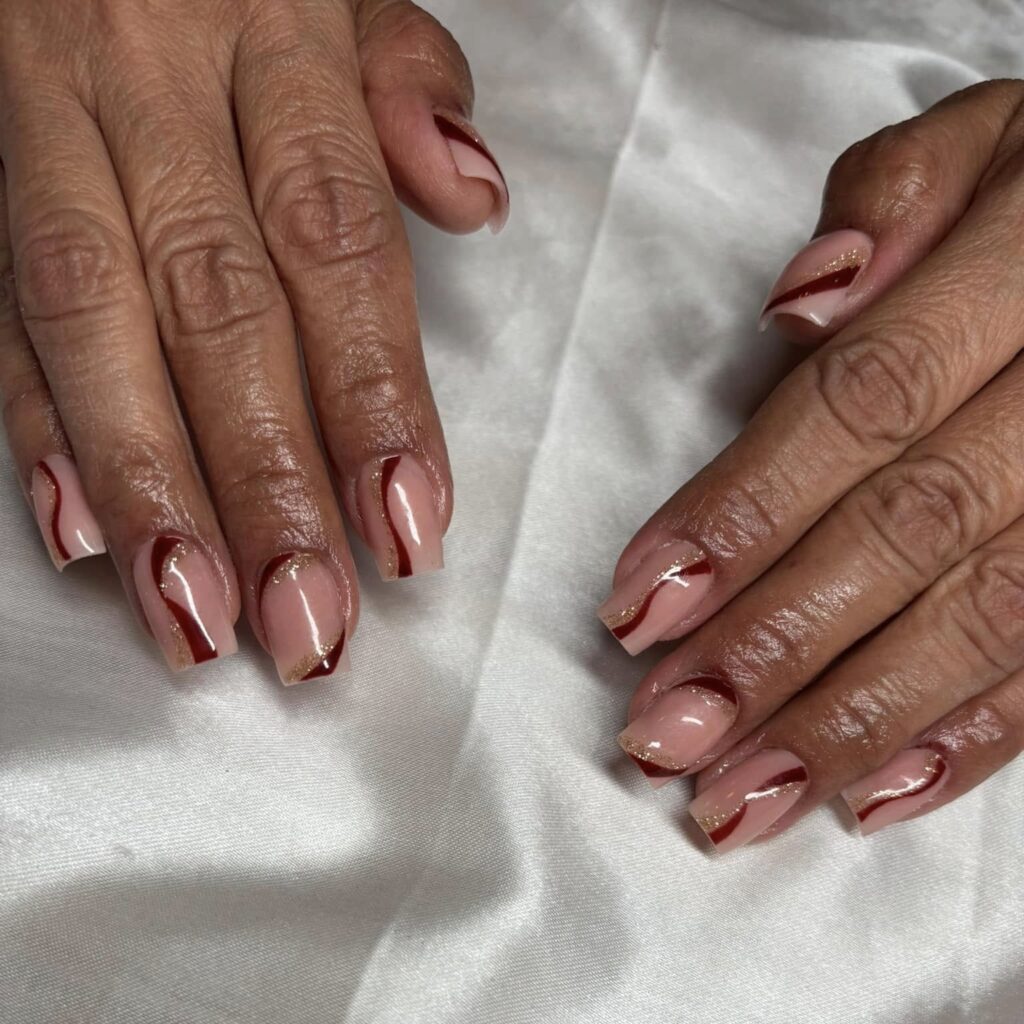 Thanksgiving Acrylic Nails with Red Swirls