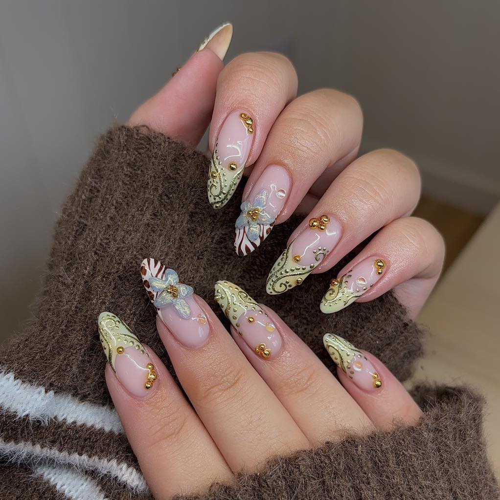 Elegant Gold Detail Almond Nails